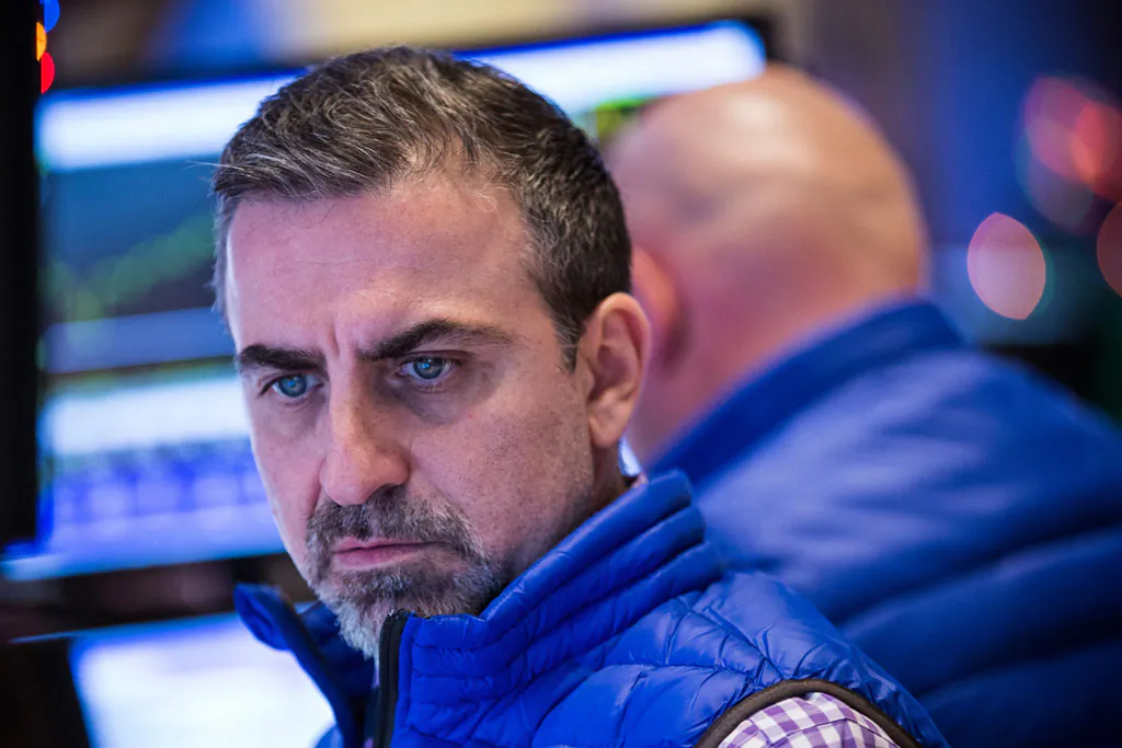 A trader works on the floor of the New York Stock Exchange during the afternoon of Dec. 17, 2014, in New York City. (Andrew Burton/Getty Images)