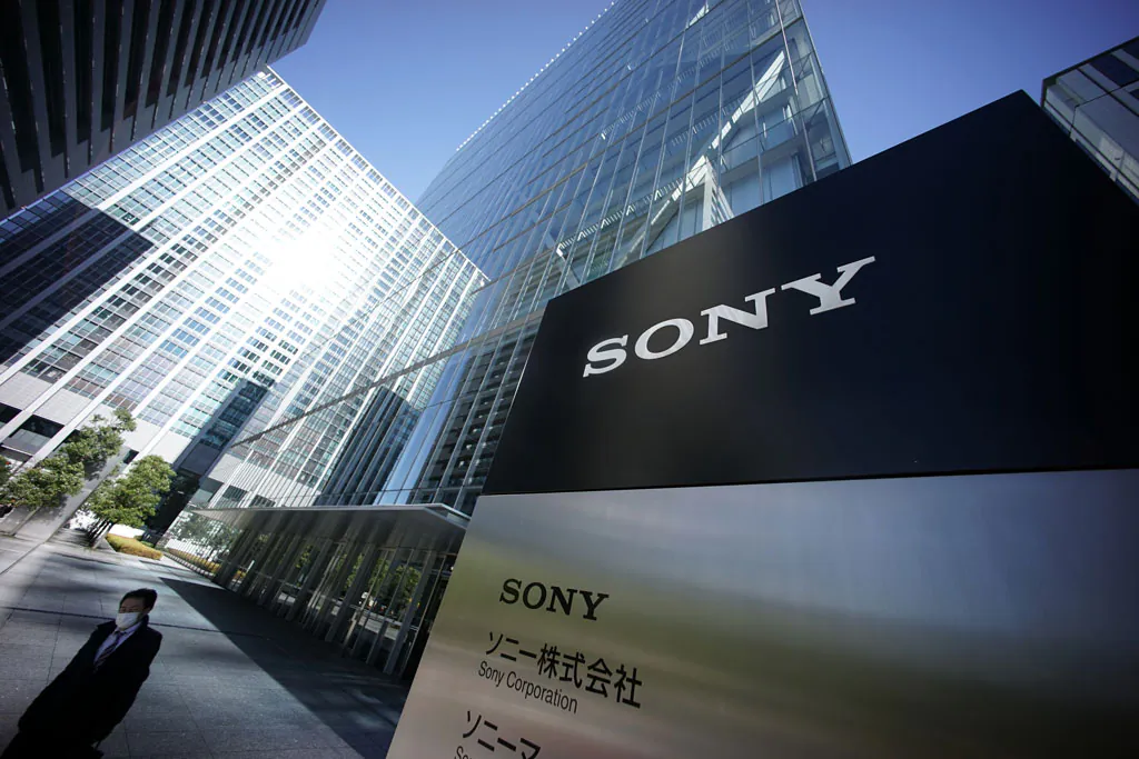 A man walks out from the headquarters of Sony Corp. in Tokyo, Thursday, Dec. 18, 2014. A U.S. official says North Korea has been linked to the unprecedented act of cyberwarfare against Sony Pictures that exposed tens of thousands of sensitive documents and escalated to threats of terrorist attacks that ultimately drove the studio to cancel all release plans for the film at the heart of the hack, "The Interview." (AP Photo/Eugene Hoshiko)