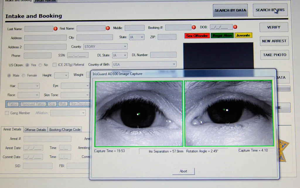 Scans of an inmate's eyes appear on a computer monitor attached to an identification system scanner on Feb. 24, 2010 at the Story County Jail in Nevada, Iowa. (AP Photo/Steve Pope)