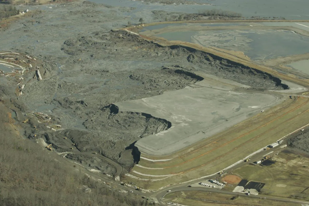 F ILE - In this Monday, Dec. 29, 2008 file image provided by Greenpeace, coal ash slurry left behind in a containment pond near the Tennessee Valley Authority's Kingston Fossil Plant is shown  in Harriman, Tenn., after the dyke at left broke Dec. 22, 2008. The Obama administration is under court order to unveil the rule Friday, Dec. 19, 2014 ending a six-year effort that began after the massive spill at the Tennessee power plant in 2008. Since then, the Environmental Protection Agency has documented coal ash waste sites tainting hundreds of waterways and underground aquifers in numerous states with heavy metals and other toxic contaminants. (AP Photo/Greeenpeace, Wade Payne)