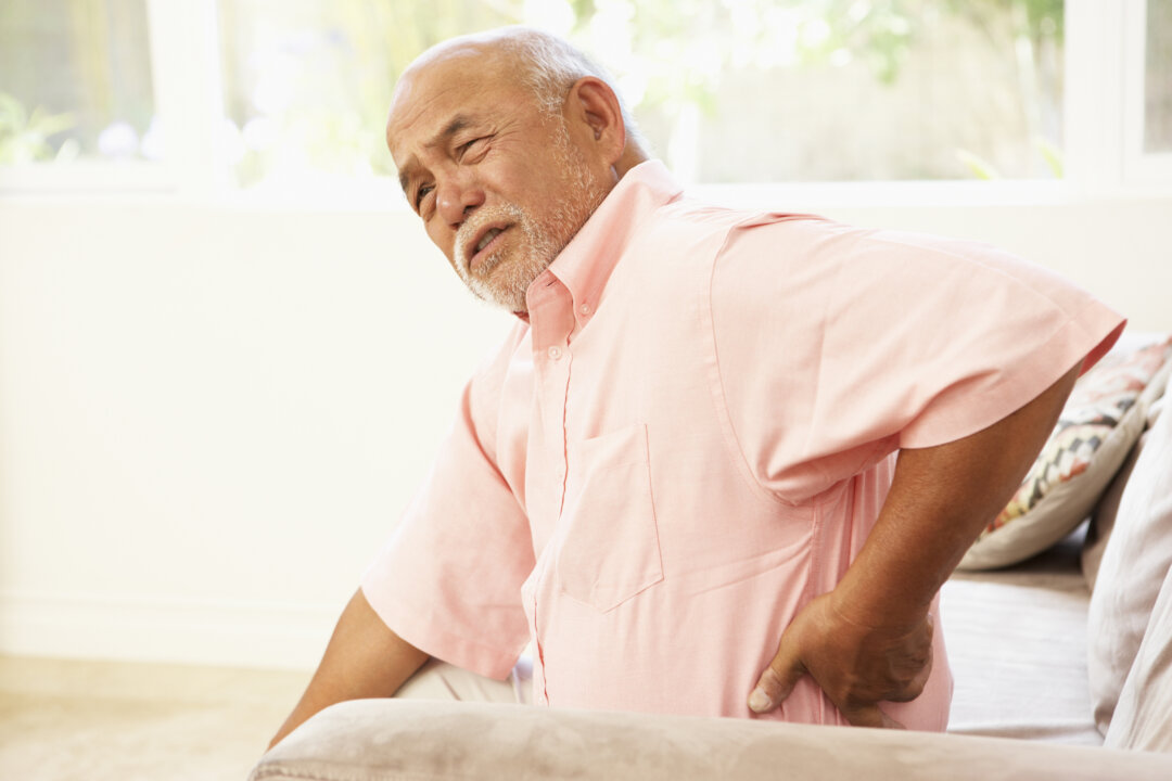 When something minor triggers back pain, it can be tempting to stay still and wait for it to pass, but movement is often the best medicine. (/Monkey Business/Thinkstock)