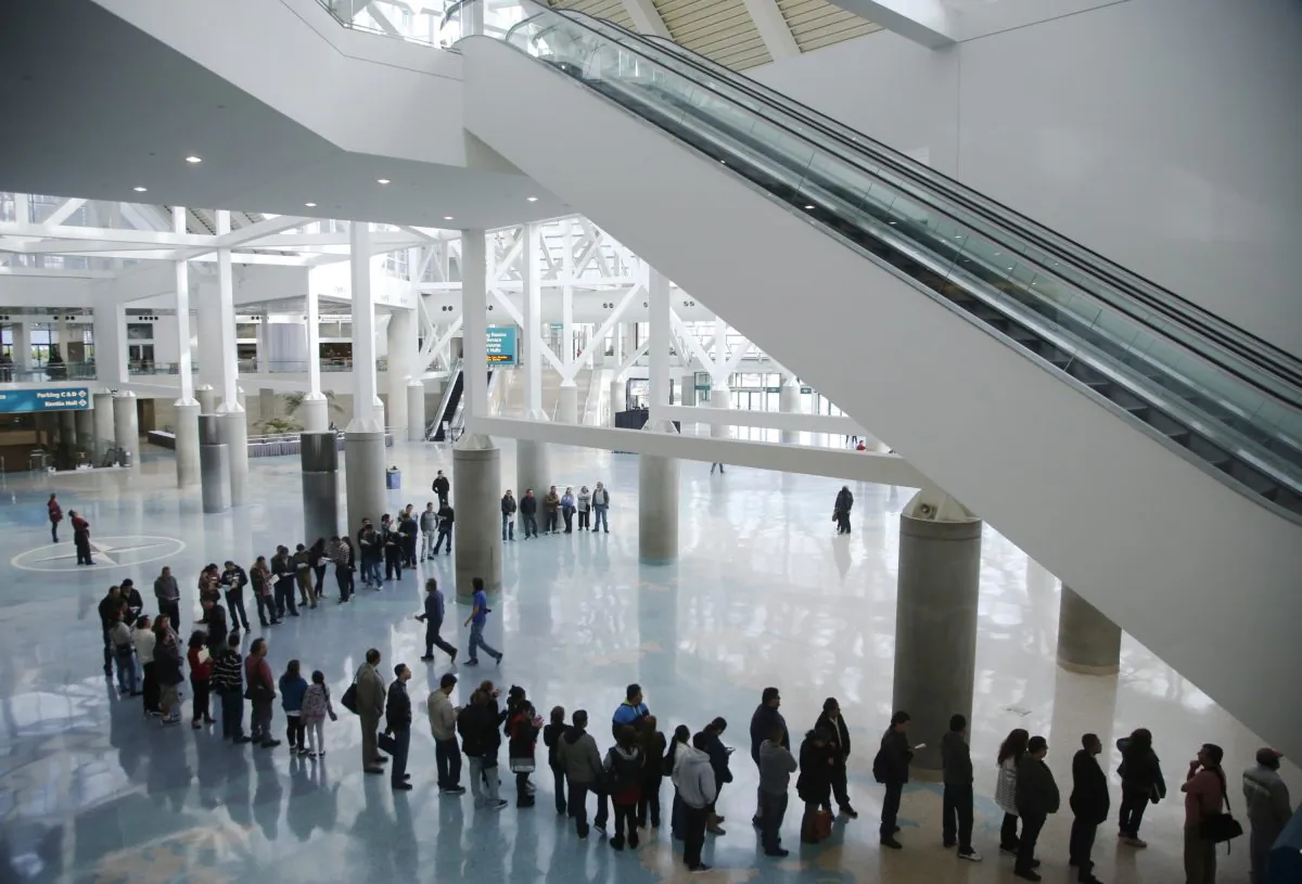 Thousands of immigrants attend the Immigration Relief Education forum organized by the Coalition for Humane Immigrant Rights of Los Angeles, CHIRLA, at the Los Angeles Convention Center on Dec. 13, 2014. (AP Photo/Damian Dovarganes)