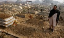 Gravedigger Weeps Burying the Dead After Pakistan’s School Massacre