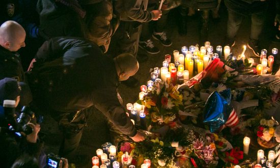 Candlelight Vigil for Slain Cops Honored by Protesters and Police Alike