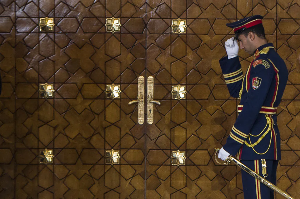 A member of the Egyptian Presidential guard stands outside a meeting room as Egyptian President Abdel-Fattah el-Sissi meets with Cyprus' President and Greek Prime Minister on Nov. 8, 2014, in Cairo. (Khaled Desouki/AFP/Getty Images)