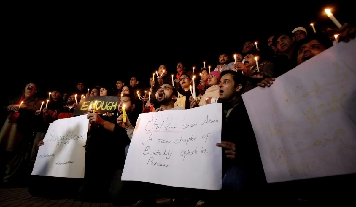 Pakistani journalists and civil society members hold a candle light vigil for the victims of a Taliban attack on a school, in Islamabad, Pakistan, Tuesday, Dec. 16, 2014. Taliban gunmen stormed a military-run school in the northwestern Pakistani city of Peshawar on Tuesday, killing more than 140, officials said, in the highest-profile militant attack to hit the troubled region in months. (AP Photo/Anjum Naveed)