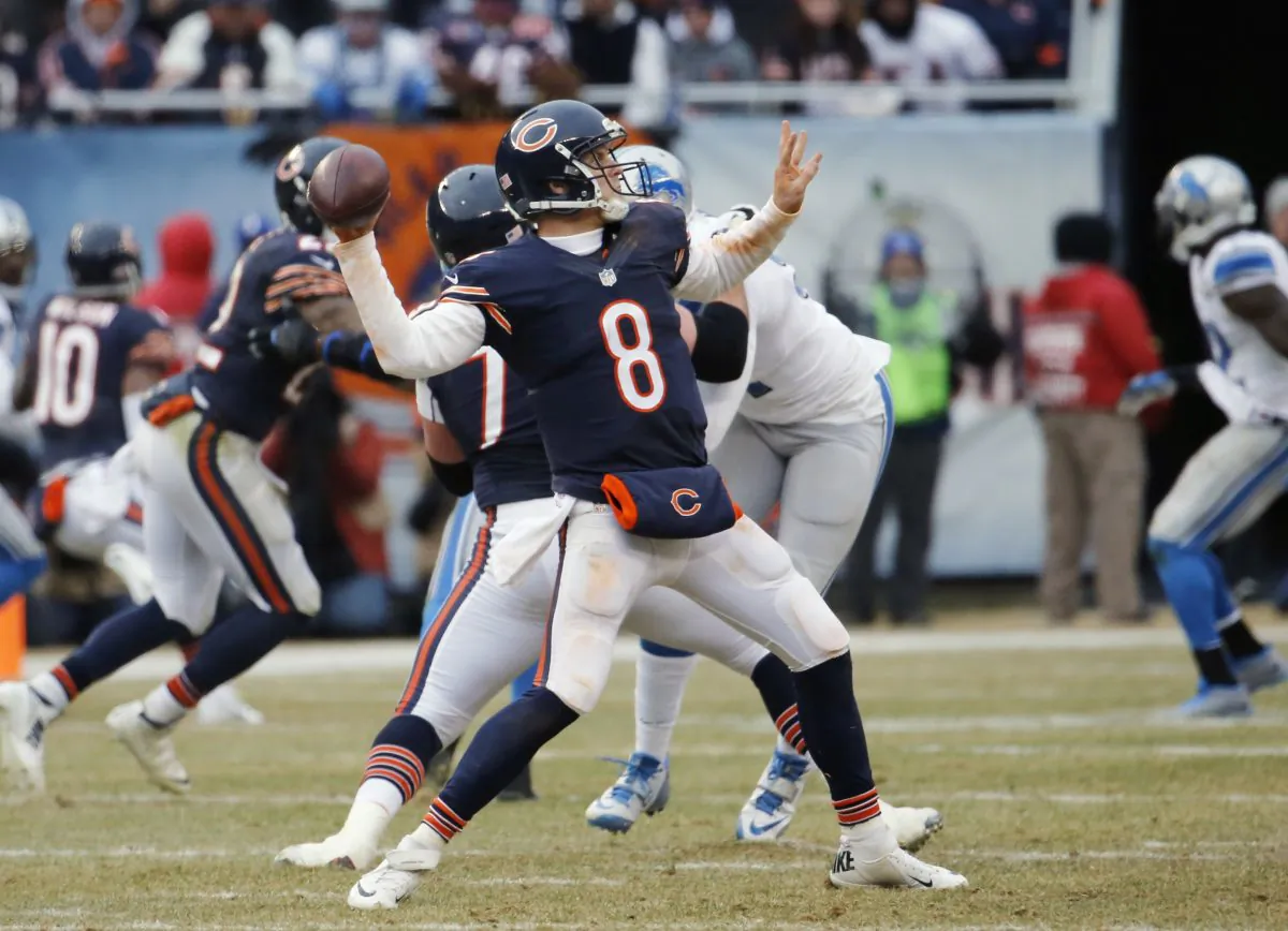 Chicago Bears quarterback Jimmy Clausen (8) throws a touchdown pass to wide receiver Alshon Jeffery in the second half of an NFL football game against the Detroit Lions Sunday, Dec. 21, 2014, in Chicago. (AP Photo/Charles Rex Arbogast)