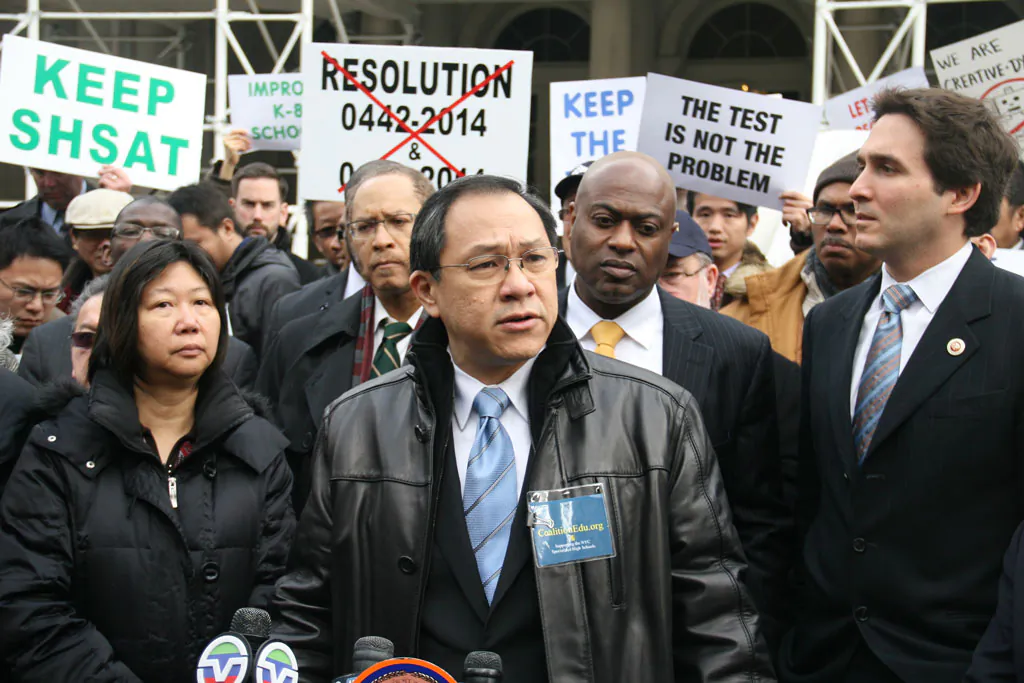 David Lee (C), 55, co-founder of a specialized high schools admissions exam advocacy group on the steps of City Hall in Manhattan, N.Y., on Dec. 11, 2014. (Shannon Liao/Epoch Times)