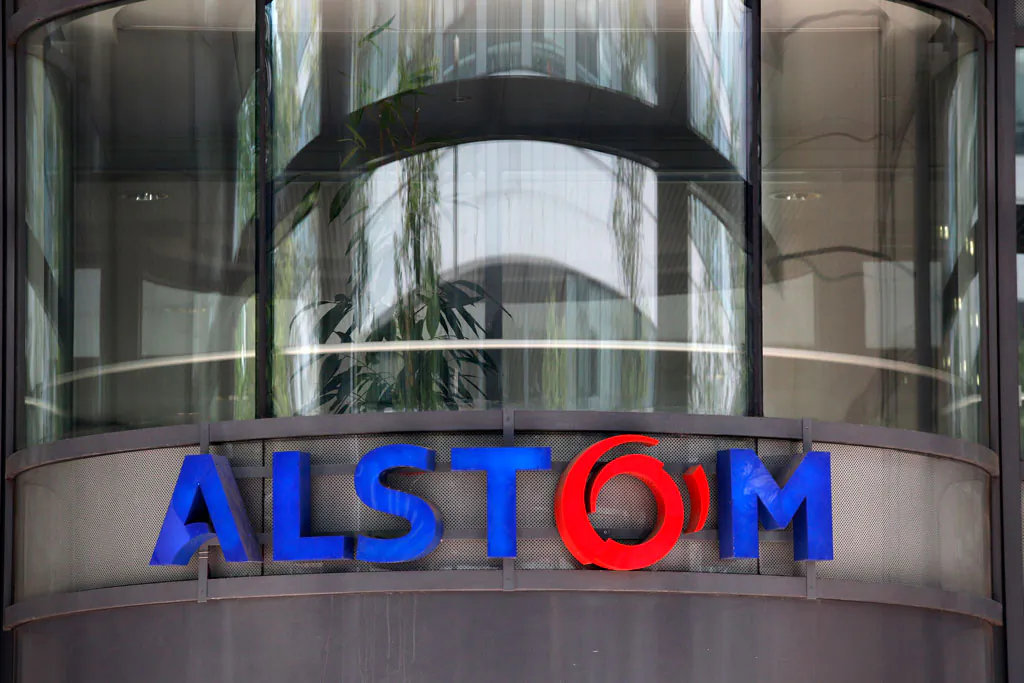 The company logo of Alstom at the headquarters of the leading global maker of high-speed trains, power plants and grids, in Levallois-Perret, outside Paris, France, on April 30, 2014. U.S Justice Department officials on Monday, Dec. 22, 2014, announced French power and transportation company has agreed to pay $772 million in penalties to resolve allegations that it bribed government officials in multiple foreign countries and would plead guilty to violating the Foreign Corrupt Practices Act. (AP Photo/Christophe Ena)