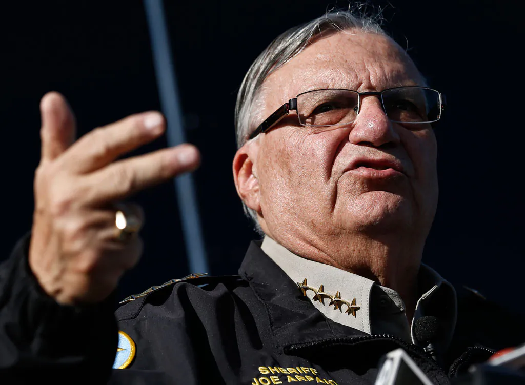 Maricopa County, Ariz., Sheriff Joe Arpaio speaks in Phoenix on Jan. 9, 2013. A gadfly attorney and a county sheriff from Arizona want to halt President Barack Obama’s immigration program in the first courtroom battle over the initiative designed to spare nearly 5 million people from deportation. On Monday, lawyer Larry Klayman will try to persuade a judge nominated by Barack Obama that the immigration system, contrary to what the president says, isn’t really broken. Klayman says the president has violated the Constitution by doing an end run around Congress and that drastic changes in immigration programs should be stopped. (AP Photo/Ross D. Franklin)