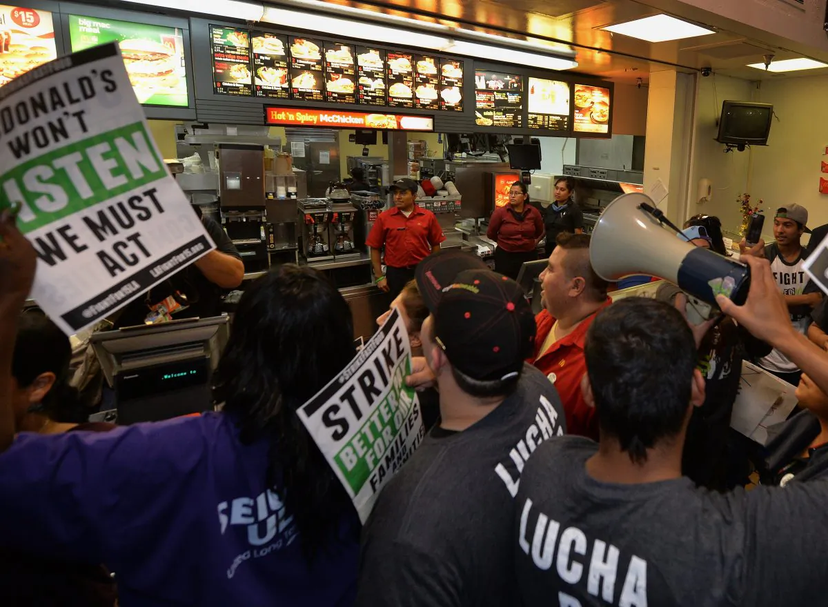 Fast-food workers at a McDonald’s restaurant during a demonstration against low wages in Los Angeles on Sept. 4. The National Labor Relation Board’s decision on Friday will help fast-food workers unionize against the fast-food chain. (Mark Ralston/AFP/Getty Images)