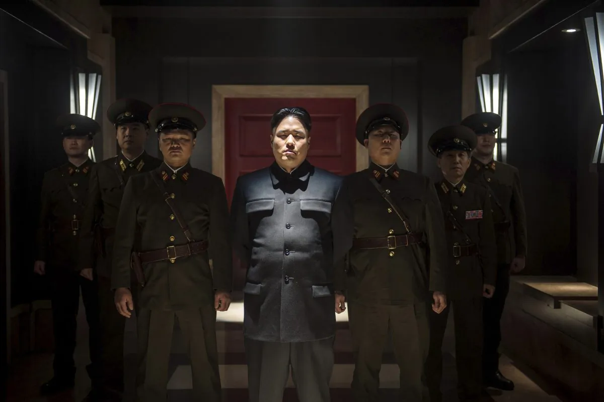 Randall Park (C) portrays North Korean leader Kim Jong Un in Columbia Pictures’ “The Interview.” If the U.S. government’s claim that North Korea was involved in the unprecedented hack attack on Sony Pictures that scuttled Seth Rogen’s latest comedy is correct, no one can say they weren’t warned. (AP Photo/Columbia Pictures/Sony/Ed Araquel)