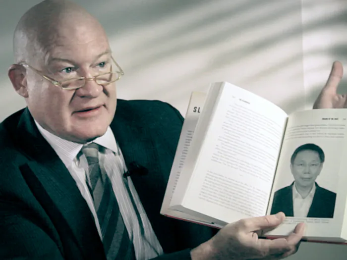Ethan Gutmann holds a copy of his book, "The Slaughter." (Courtesy of subject)
