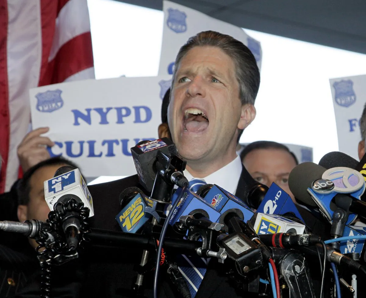 Patrick Lynch, head of the nation’s largest police union, at the Bronx Supreme Court in New York on Oct. 28, 2011. Theatrics aren’t a new tactic for Lynch, but an ongoing war of words with New York’s Mayor Bill de Blasio is a notch up even for Lynch, who is usually the most outspoken, the most amped up in the room. (AP Photo/David Karp)
