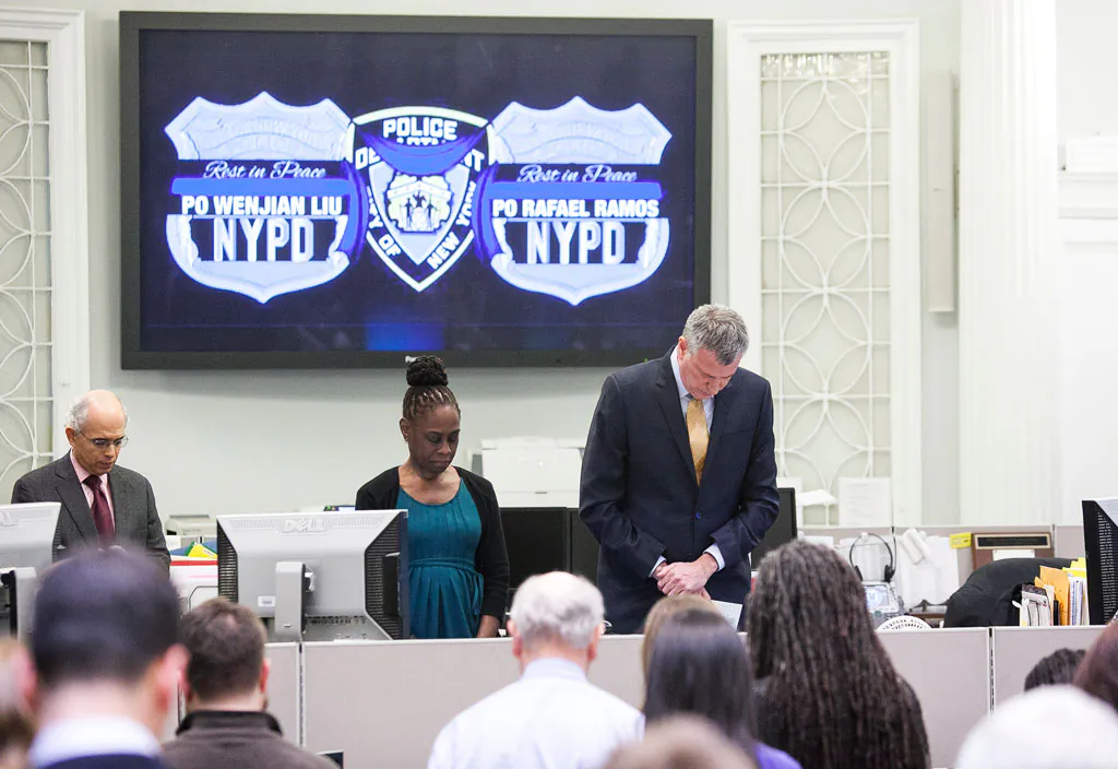 City Hall honors fallen police officers Rafael Ramos and Wenjian Liu with a moment of silence at 2:47 p.m. in New York City on Dec. 23, 2014, marking the instant at which the officers were shot on a Brooklyn street corner. (Samira Bouaou/Epoch Times)