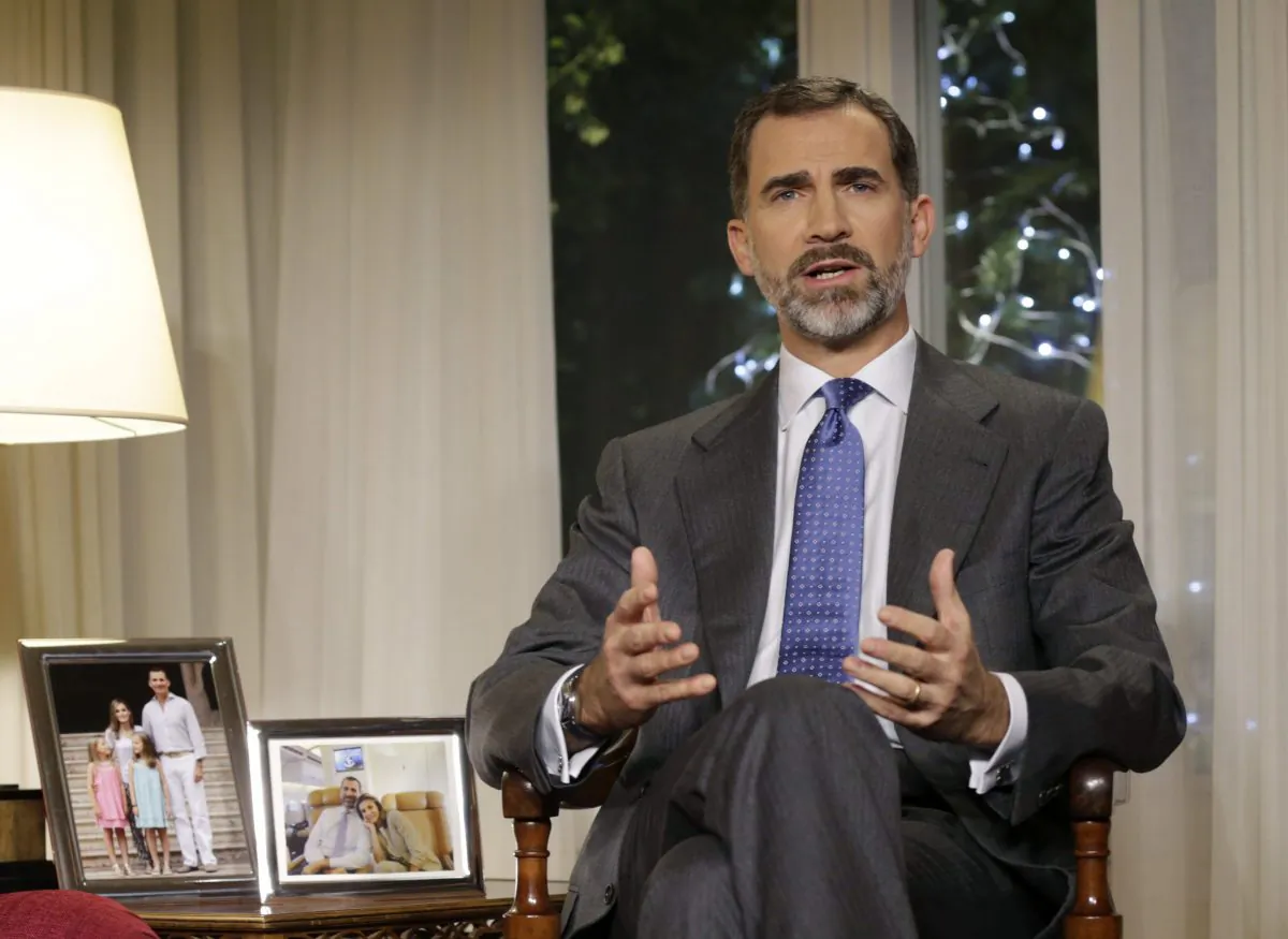Spain's King Felipe VI gives an speech at the Zarzuela Palce, near Madrid. The speech watched by millions on TV is the most important national address by Spanish kings and is a chance for Felipe to show his style as king six months after his father Juan Carlos abdicated and tell the nation what he thinks about the state of the economically hurting country and what Spaniards must do to improve it. (AP Photo/Angel Diaz)
