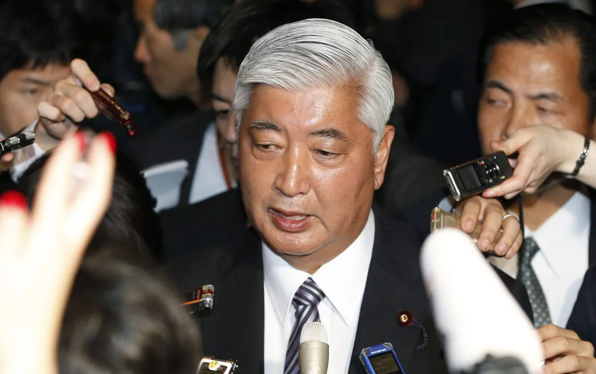 Japan's newly-appointed Defense Minister Gen Nakatani answers reporters' questions at the prime minister's official residence in Tokyo Wednesday, Dec. 24, 2014. Shinzo Abe won endorsement Wednesday to serve another term as prime minister after winning a renewed mandate for his "Abenomics" strategies for reviving the world's third-biggest economy. Abe appointed a former military officer, Nakatani, as defense minister but kept the other members of his previous cabinet. (AP Photo/Shizuo Kambayashi)
