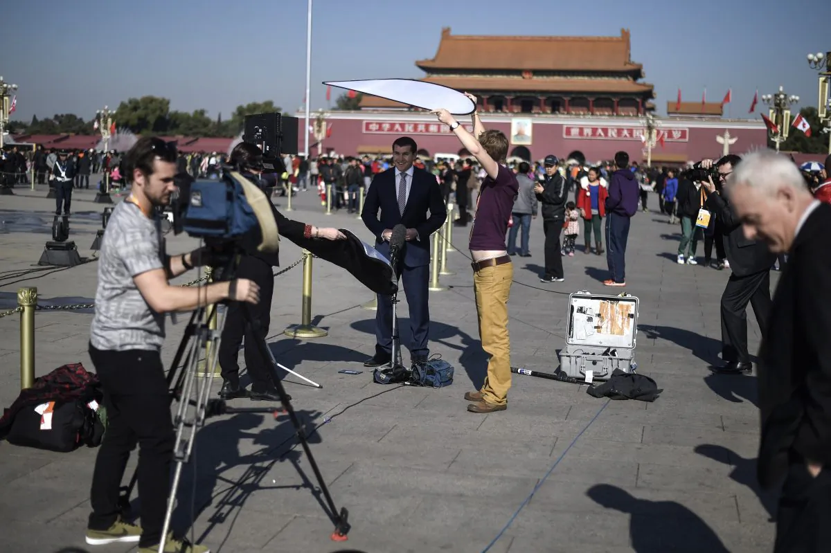 Foreign journalists work in Tiananmen Square in Beijing, China in this file photo. (Fred Dufour/AFP/Getty Images)