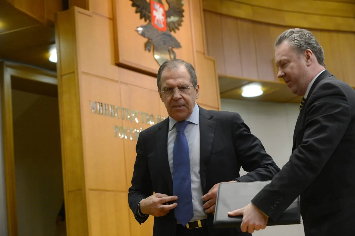 Russian Foreign Minister Sergei Lavrov (L) speaks with Foreign Ministry spokesman Alexander Lukashevich (R) after holding his traditional start-of-year press conference in Moscow, on Jan. 23, 2013, with attention focused on Russia's position on the raging conflict in Syria. (Kirill Kudryavtsev/AFP/Getty Images)