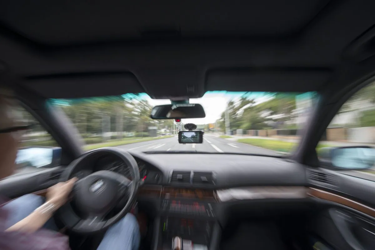 In this photo illustration a small action camera hangs attached inside the windshield of a car on Aug. 23, 2014 in Darmstadt, Germany. (Thomas Lohnes/Getty Images)