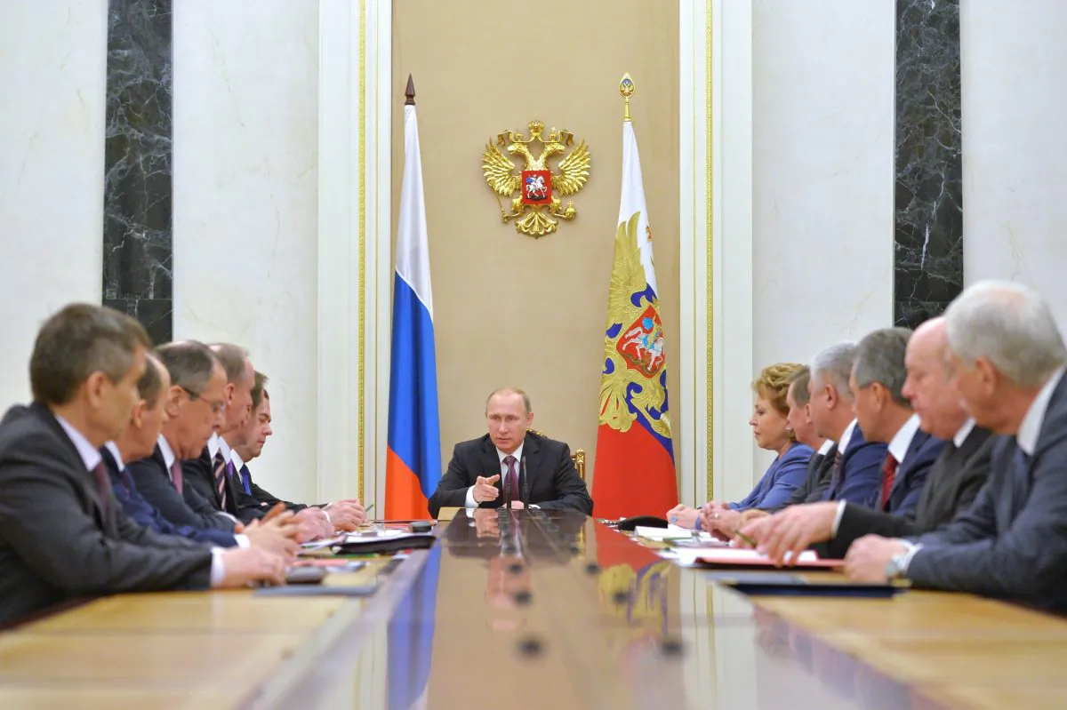 Russian President Vladimir Putin, center, heads the Security Council in Moscow's Kremlin, Russia on Friday, Dec. 26, 2014. (AP Photo/RIA Novosti, Alexei Druzhinin, Presidential Press Service)