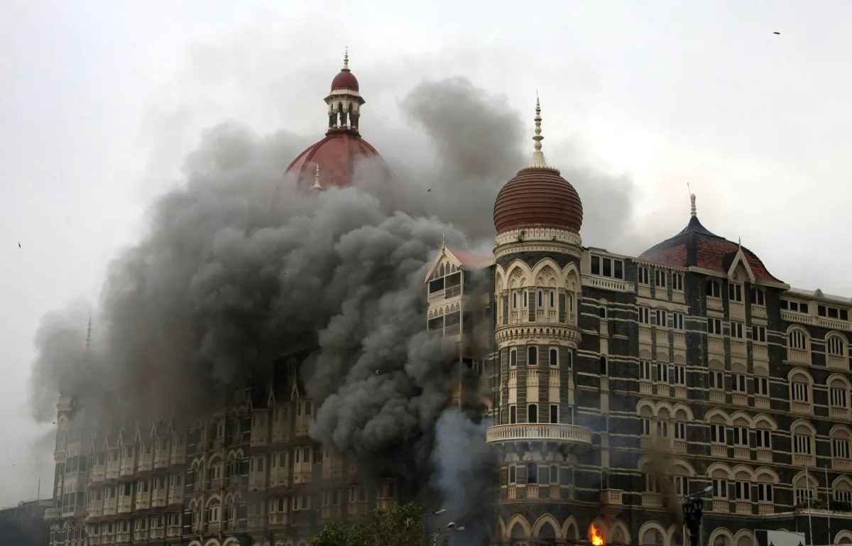 Smoke and flames billow out from The Taj Mahal hotel in Mumbai on Nov. 29, 2008. (Sajjad Hussain/AFP/Getty Images)
