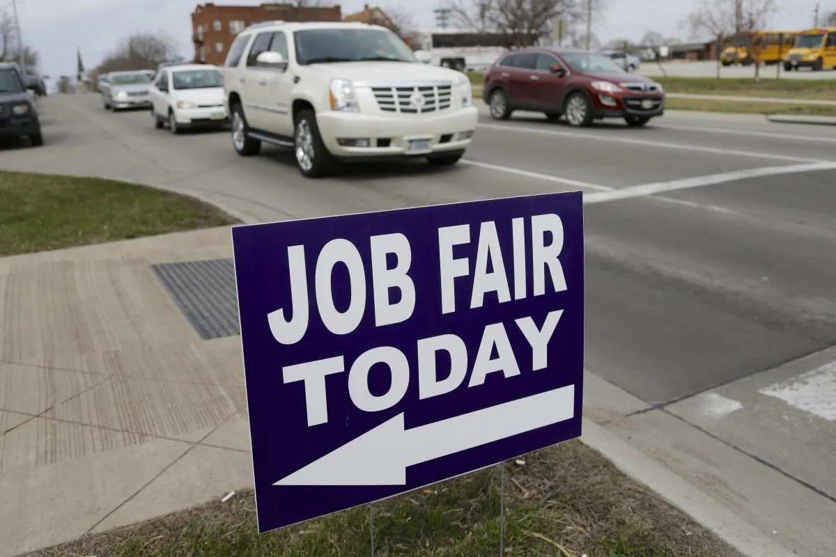 A sign to a job fair on the campus of Kaplan University in Lincoln, Neb., on April 10, 2014. (AP Photo/Nati Harnik)