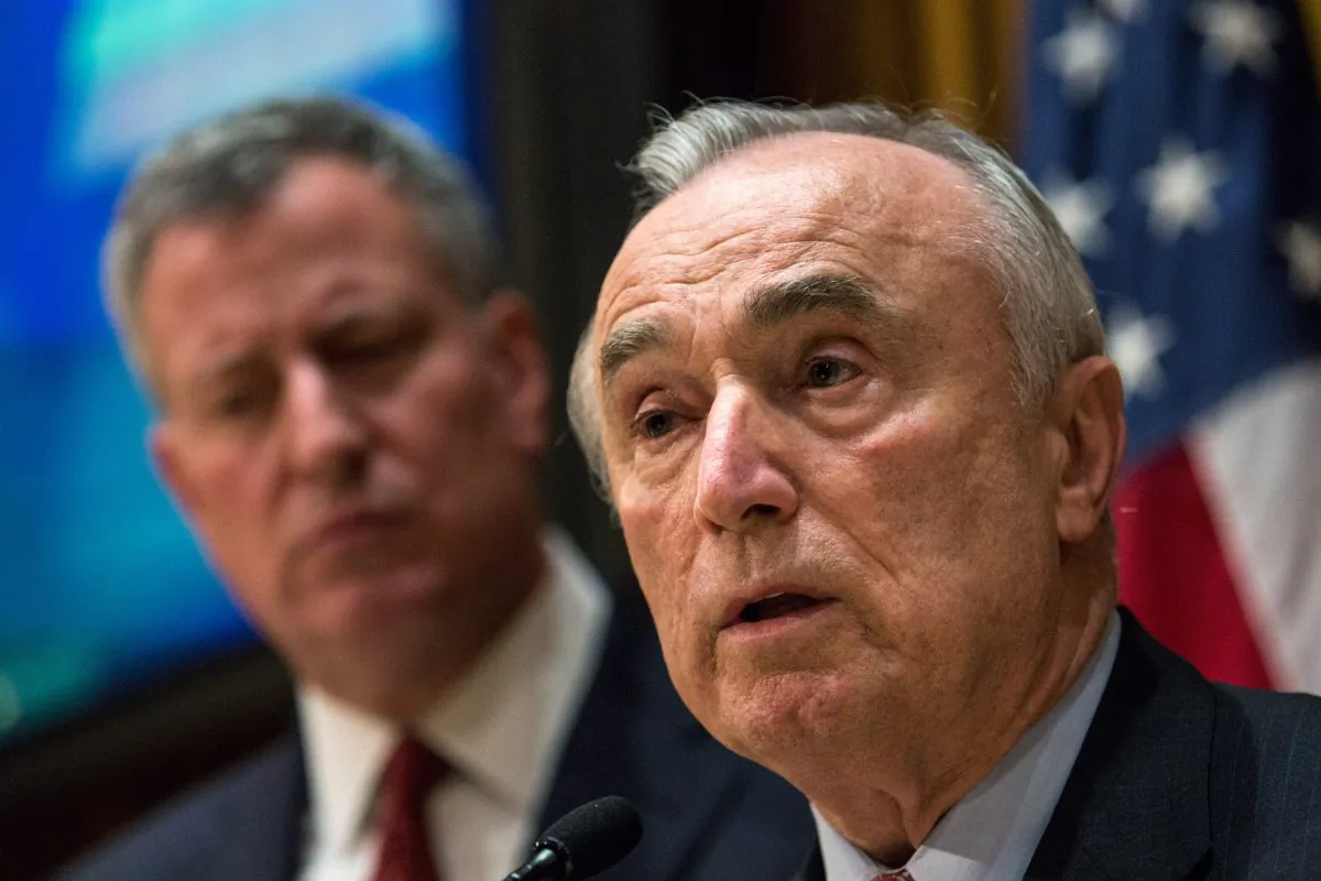 NYPD Commissioner Bill Bratton (R) and NYC Mayor Bill de Blasio speak at a press conference regarding two police officers who were killed on Saturday on Dec. 22, 2014, in New York City. (Andrew Burton/Getty Images)