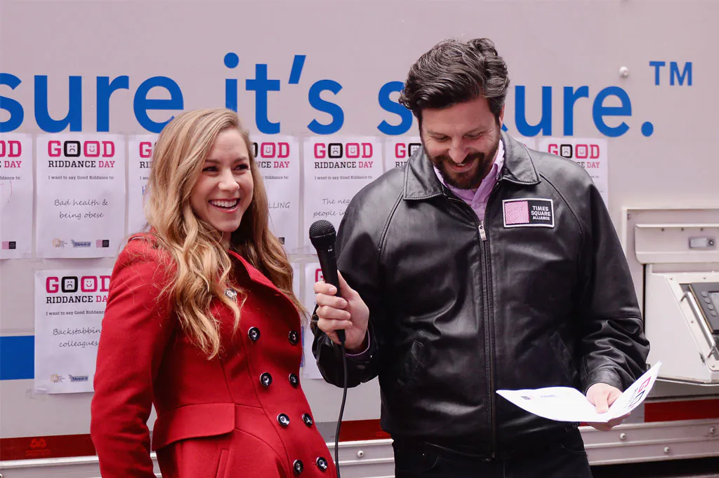 Radio/TV personality Allison Hagendorf and Tim Tompkins of The Times Square Alliance attend The 'Good Riddance Day' Event at Times Square, Broadway Plaza, in NYC, on Dec. 28, 2014. The Times Square Alliance along with Shred-it International collaborated to provide a mobile shredding truck so participants could watch their bad memories be permanently destroyed. (Stephen Lovekin/Getty Images)