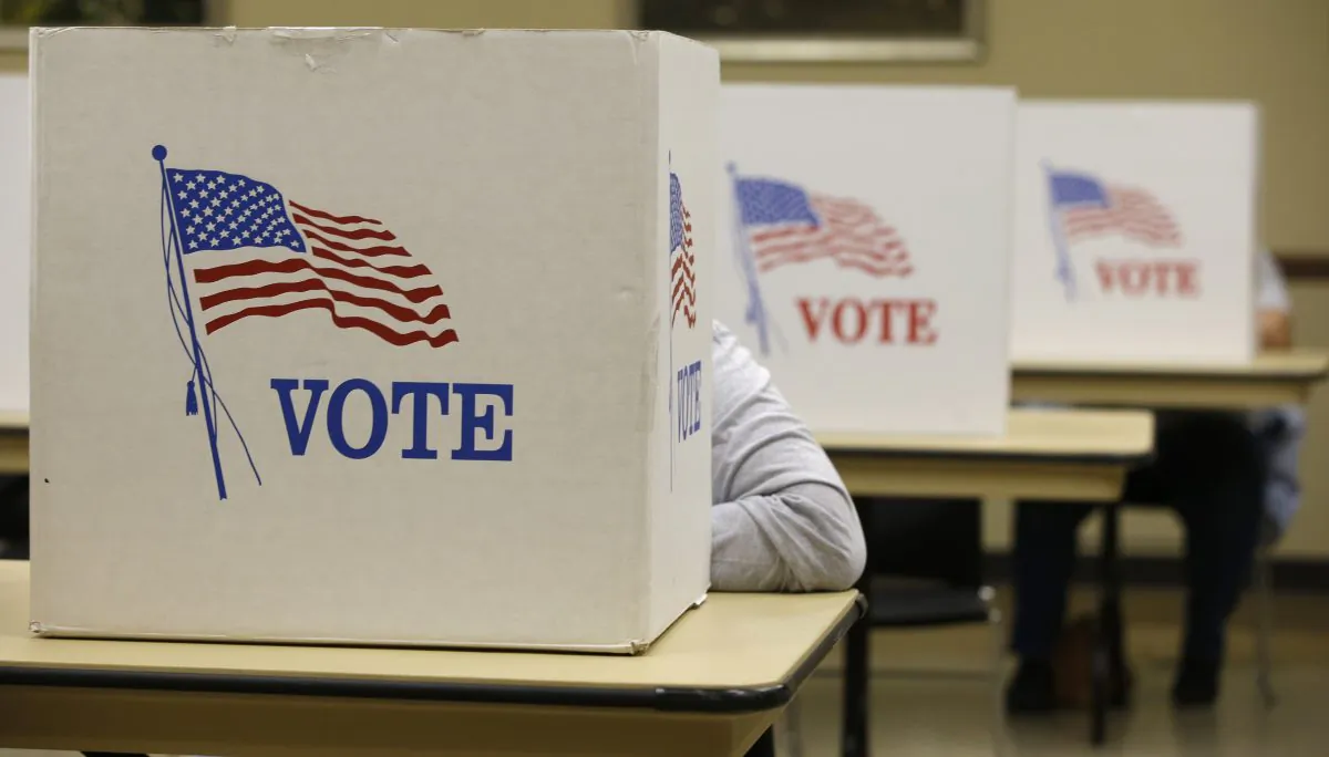 A voter marks her ballot at in Brooklyn, Iowa on Nov. 4, 2014. (Darron Cummings/AP Photo)