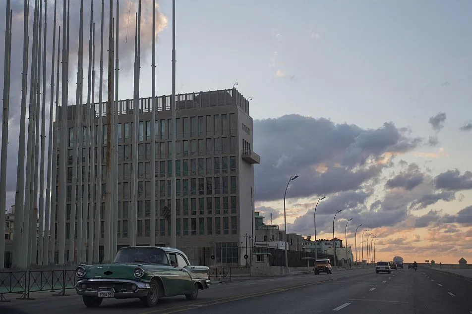A classic American car being driven in Havana, Cuba, on Dec. 17. Most Americans now favor ending embargoes on Cuba.
(Desmond Boylan/AP)