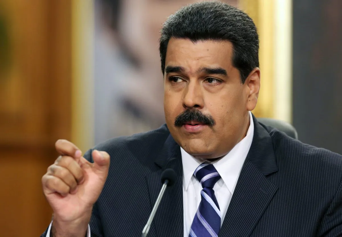 Venezuela's President Nicolas Maduro speaks during a press conference at Miraflores Presidential Palace in Caracas, Venezuela, Tuesday, Dec. 30, 2014. Venezuela’s socialist government Tuesday confirmed the economy fell into a deep recession this year but blamed the slump on opponents trying to sabotage activity in the oil-rich nation. (AP Photo/Ariana Cubillos)