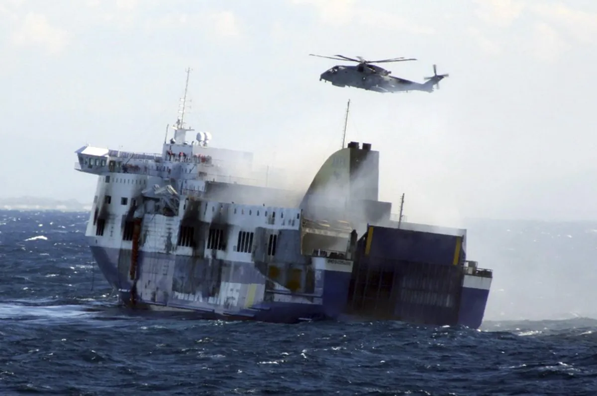 In this image released by the Italian Navy, smoke billows from the Italian-flagged Norman Atlantic that caught fire in the Adriatic Sea, Monday, Dec. 29, 2014. (AP Photo/Italian Navy, ho)