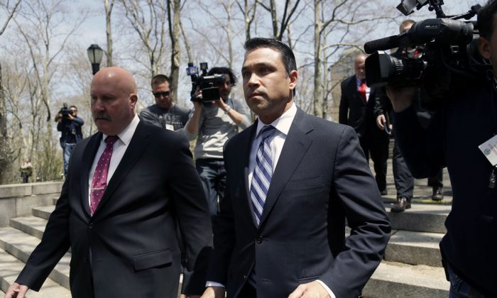 US Rep. Michael Grimm leaves a news conference outside federal court in New York on April 28, 2014. (AP Photo/Seth Wenig)