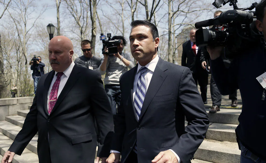 US Rep. Michael Grimm leaves a news conference outside federal court in New York on April 28, 2014. (AP Photo/Seth Wenig)