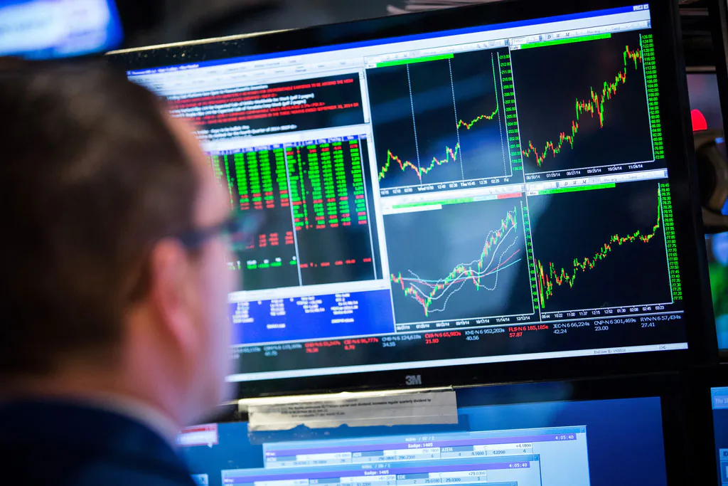 A trader works on the floor of the New York Stock Exchange during the afternoon of Dec. 18, 2014, in New York City. (Andrew Burton/Getty Images)