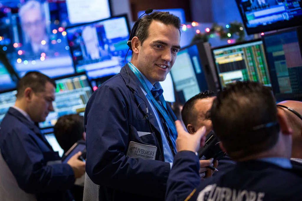 Traders work on the floor of the New York Stock Exchange during the afternoon of Dec. 18, 2014, in New York City. (Andrew Burton/Getty Images)