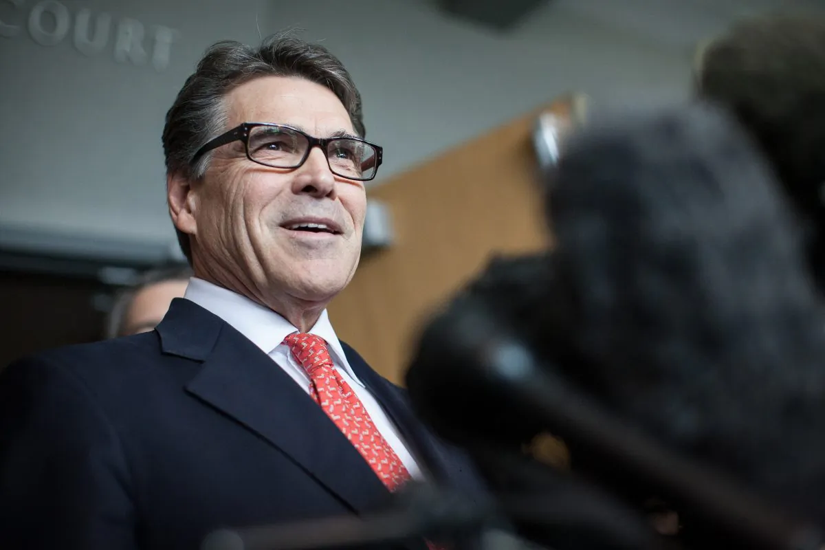 In this Nov. 6, 2014 file photo, Texas Gov. Rick Perry answers questions from the media following a hearing on felony abuse of power charges at the Blackwell-Thurman Criminal Justice Center, in Austin, Texas. (AP Photo/Tamir Kalifa)