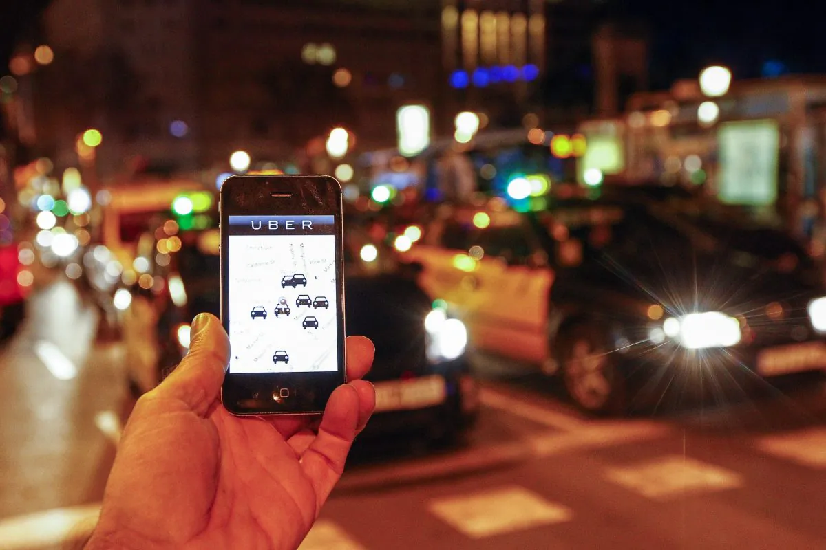 The Uber app on a smartphone in Barcelona on Dec. 9. A judge on Dec. 9 banned the popular smartphone taxi service Uber from operating in Spain. (Quique Garcia/AFP/Getty Images)