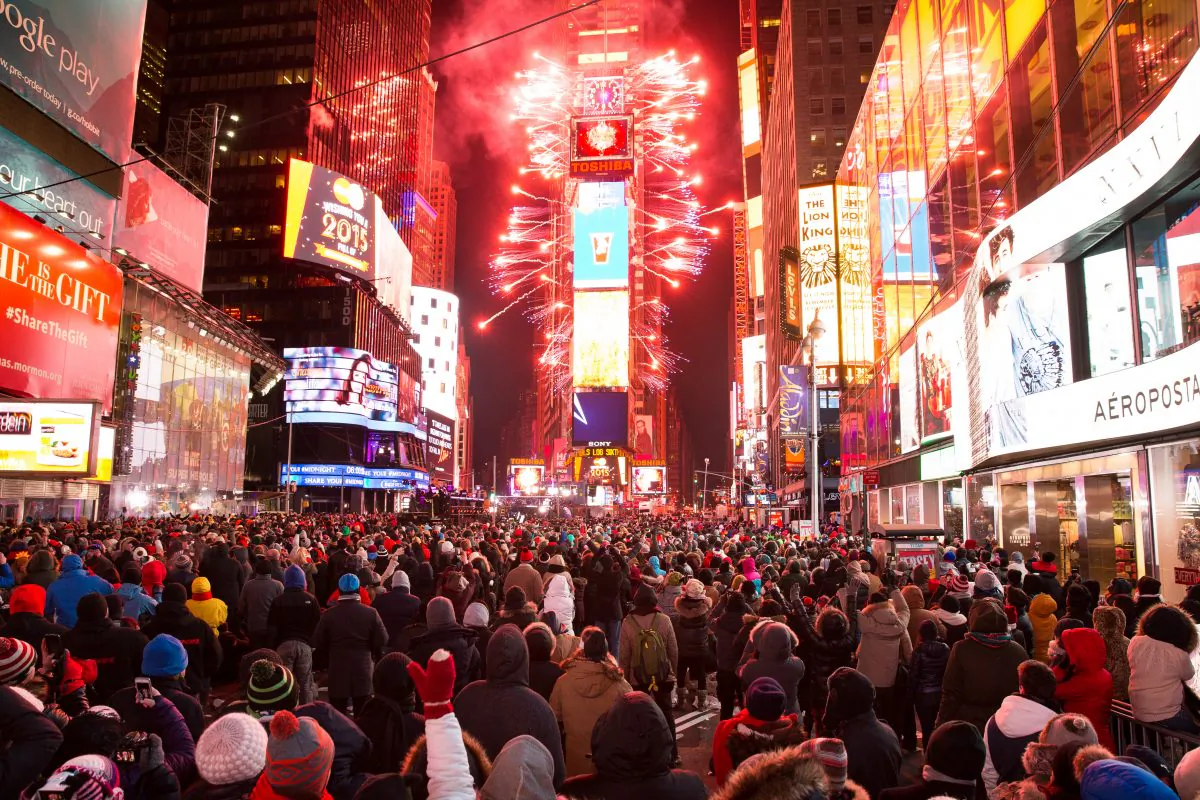 JAN 1: People cheer as the ball drops at midnight in Times Square, New York City, on Jan. 1, 2015.  An estimated one million people from around the world are expected to pack Times Square to ring in 2015. (Dai Bing/Epoch Times)