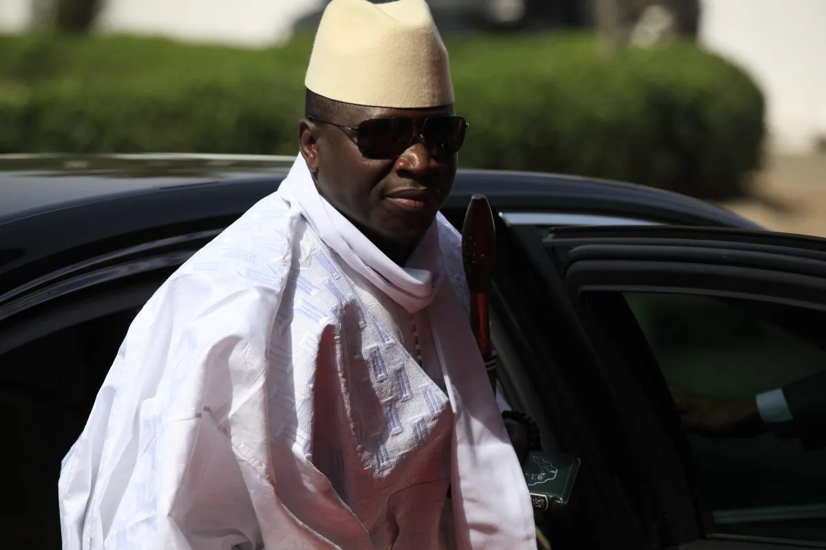 Gambia's President Yahya Jammeh arrives for a summit to address a seminar on security during an event marking the centenary of the unification of Nigeria's north and south in Abuja, Nigeria, Feb. 27, 2014. (AP Photo/Sunday Alamba)