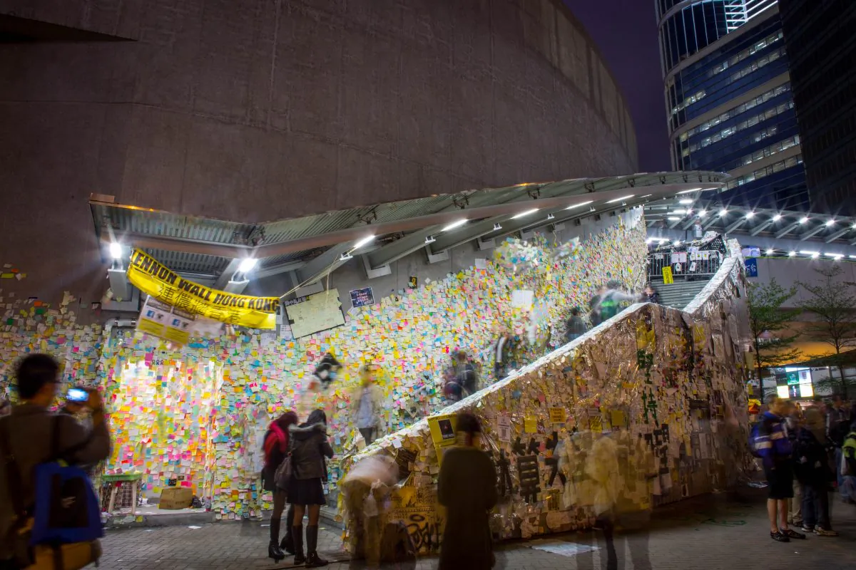 People look at the Lennon Wall on the road outside Hong Kong's Government Complex on Dec. 9, 2014 in Hong Kong. (Chris McGrath/Getty Images)