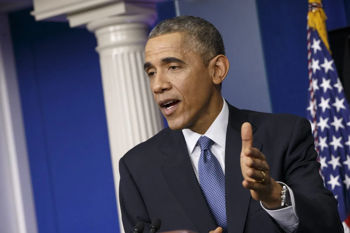 FILE - In this Dec. 19, 2014 file photo, President Barack Obama speaks during a news conference in the Brady Press Briefing Room of the White House in Washington. The U.S. is imposing sanctions on North Korea in retaliation for the cyberattack against Sony Pictures Entertainment. President Barack Obama signed an executive order on Friday authorizing the sanctions. Although the U.S. has already sanctioned North Korea over its nuclear program, these are the first sanctions punishing Pyongyang for alleged cyberattacks. (AP Photo/J. Scott Applewhite, File)