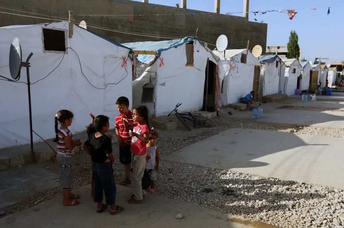 Syrian refugee children play outside their tent in a Syrian refugee camp in the eastern town of Marj, Bekaa valley, Lebanon, on June 29, 2014. The Syrian ambassador to Lebanon called on Saturday, Jan. 3, 2015, for coordination with Lebanese authorities after Beirut announced plans to impose unprecedented restrictions on Syrians trying to enter Lebanon. The move marks the most significant attempt by Lebanese authorities to stem the massive influx of an estimated 1.5 million Syrians who have sought refuge in Lebanon from the civil war raging in their homeland. (AP Photo/Bilal Hussein)