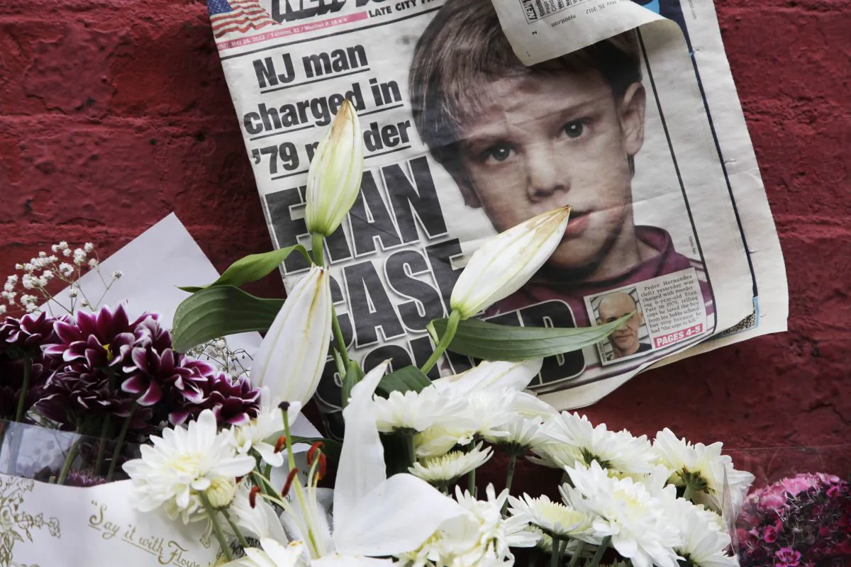 A newspaper with a photograph of Etan Patz that is part of a makeshift memorial in the SoHo neighborhood of New York on May 28, 2012. As the murder case surrounding Patz' notorious 1979 disappearance heads to trial, missing-children’s advocates see it as proof that such cases still can be pursued after decades. (AP Photo/Mark Lennihan)