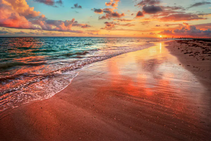 Colorful sea beach sunset via Shutterstock*