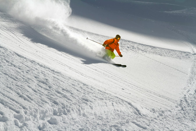 Skier in deep powder snow via Shutterstock*