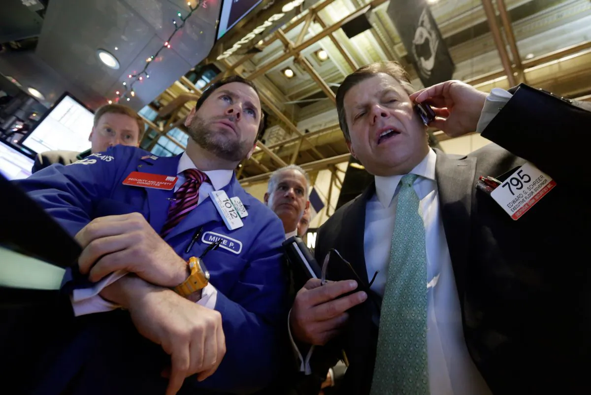 Specialist Michael Pistillo (L) and trader Edward Schreier (R) on the floor of the New York Stock Exchange Tuesday, Jan. 6, 2015. The U.S. stock market is edging higher in early trading as the price of oil extends its slump. (AP Photo/Richard Drew)
