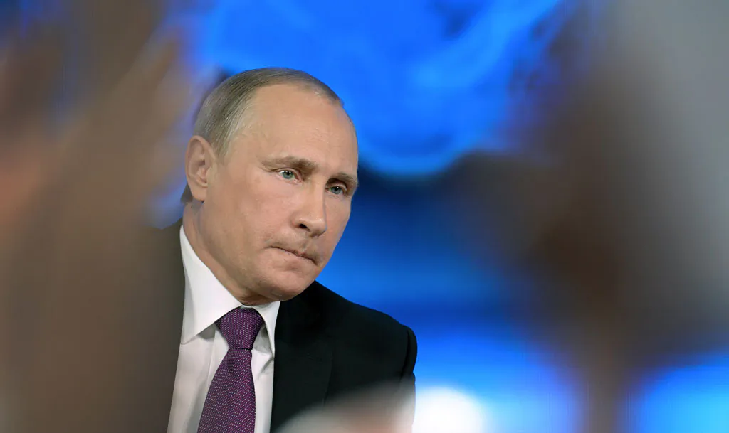 Russian President Vladimir Putin gives his annual press conference in Moscow on Dec. 18, 2014. Putin crushed Chechnya's rebellion, pushed back Russia's frontiers and restored the pride of a nation humiliated by the demise of the Soviet Union. But 15 years after he came to power Vladimir Putin's faces his biggest challenge yet: how to manage the worst monetary crisis of his era. (Alexander Nemenov/AFP/Getty Images)