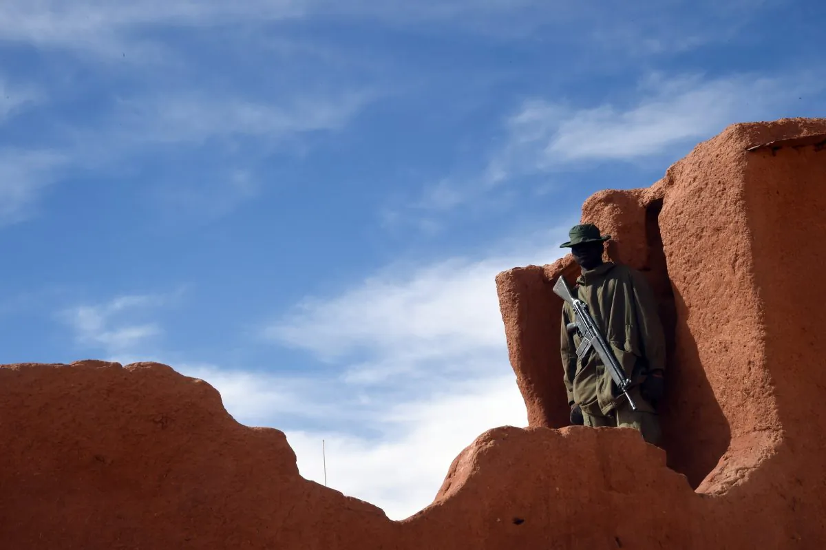 A Nigerian soldier stands guard in Madama near the border with Lybia on Jan. 1, 2015. (Dominique Faget/AFP/Getty Images)